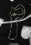 Chanel Long Pearl Necklace with CC Logo