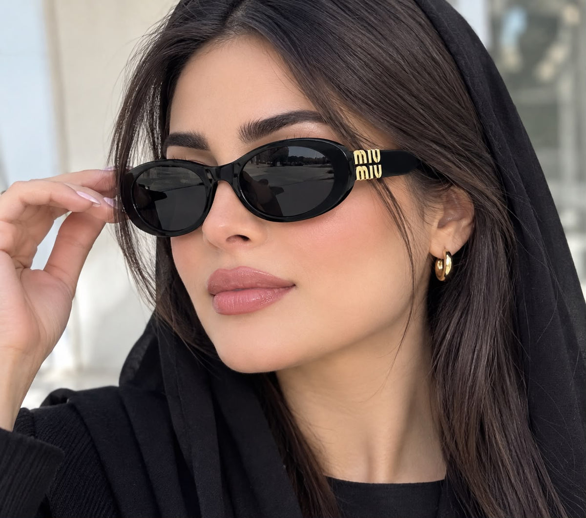 Miu Miu Oval Gold Logo Sunglasses