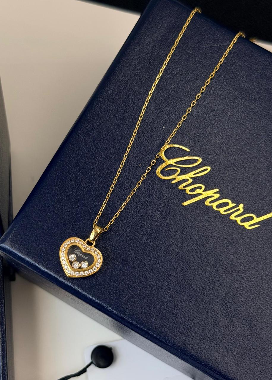 Chopard Happy Diamonds Heart Pendant Necklace — White-Tone Metal with Three Floating Stones and Pavé-Set Heart Border.