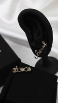 CHANEL – Gold Script Logo Earrings